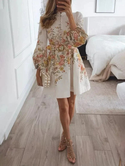 Mini-jurk met bloemenprint en knoopjes